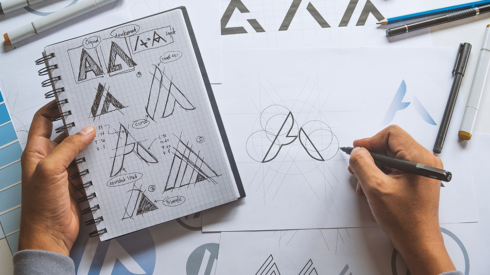 designing a logo with pen and paper