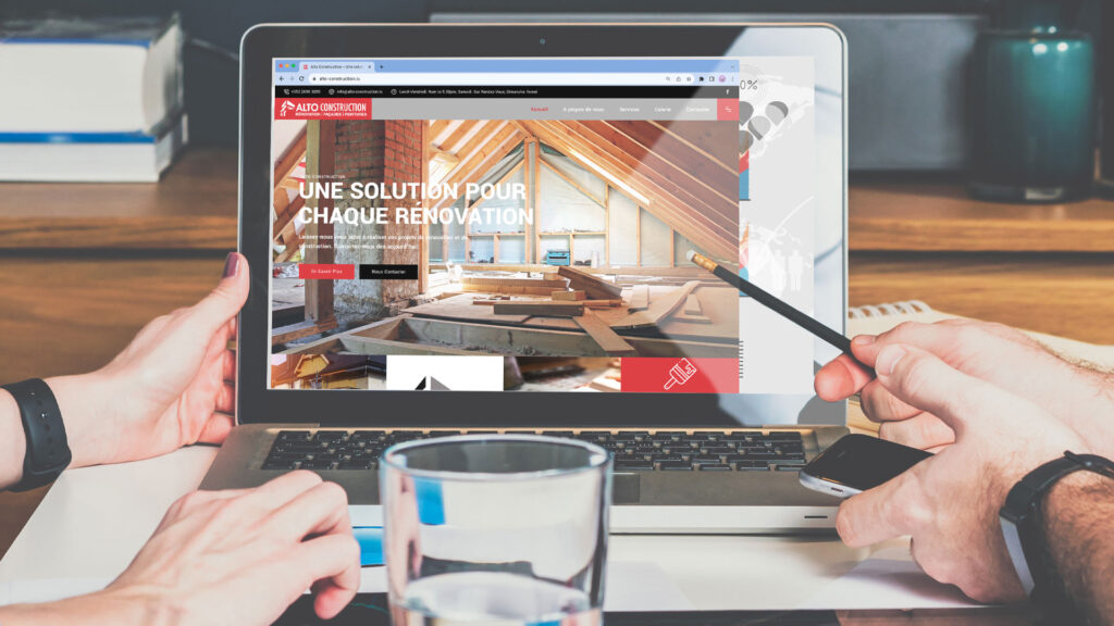 Substance web design of alto construction website, open laptop on desk showing website homepage